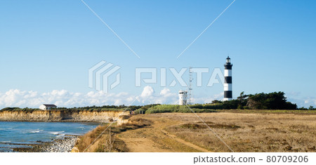 Lighthouse with blue sky, golden cliffs during summer in chassiron, Oleron Island, France. Lighthouse with blue sky, golden cliffs during summer in chassiron, Oleron Island, France. 80709206