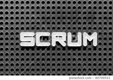 White alphabet letter in word scrum on black pegboard background 80709501