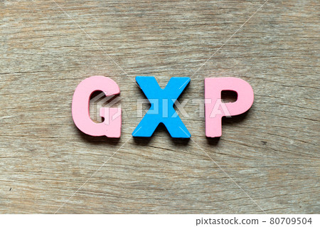 Color alphabet letter in word GXP on wood background 80709504