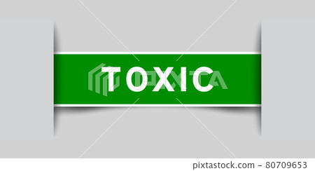Label sticker green color in word toxic that inserted in gray background 80709653