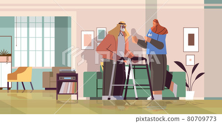 friendly nurse or volunteer supporting arab elderly man with walkers home care services healthcare 80709773