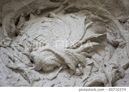 Gypsum plaster symbol. Gypsum plaster in a bucket, prepared for application on the wall. Beautiful texture. Conceptual background. Gypsum plaster and construction concept. Gypsum plaster symbol. Gypsum plaster in a bucket, prepared for application on the wall. Beautiful texture. Conceptual background. Gypsum plaster and construction concept. 80710374