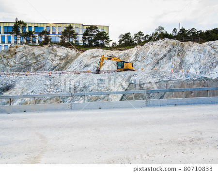 Heavy machine working on construction site, Norway Heavy machine working on construction site, Norway 80710833
