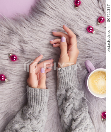Womans hands with fashionable lavender manicure. Winter christmas nail design 80711357