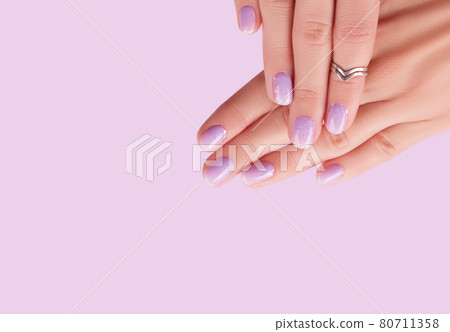 Womans hands with trendy lavender manicure. Spring summer nail design 80711358