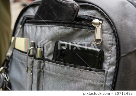 Backpack section with organizer.. Smartphone, keys, wallet in a backpack. Urban backpack with organizer. 80711452