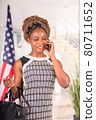 African American woman talking with her cell phone and smiling 80711652