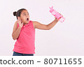 Little girl holding a bottle of water with surprised expression 80711655