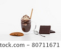 Delicious cup of chocolate milkshake with whipped cream, sprinkles and tube wafer 80711671