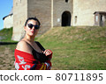 Portrait of woman against the background of old ruins 80711895