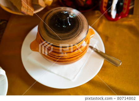 Fish soup with herbs in a pot. Fish soup with herbs in a pot. 80714802