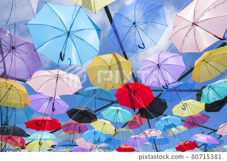 Many umbrellas lined up in the summer sky 80715381