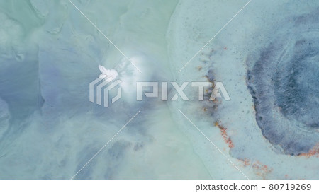 Drop on a blue background spreads out in waves in different directions. 80719269