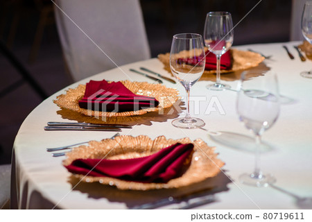 Festively served table at restaurant for a banquet. Festively served table at restaurant for a banquet. 80719611