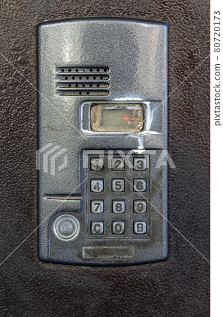 Dirty Intercom at the door of an apartment building. 80720173