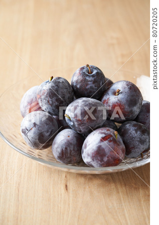 Domestic prunes served in a glass bowl 80720205