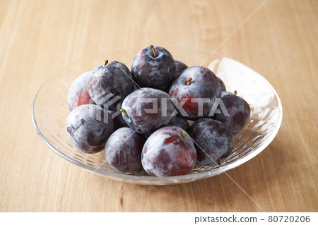 Domestic prunes served in a glass bowl 80720206