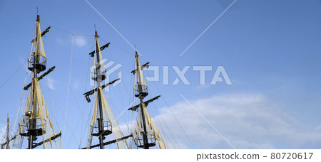 The masts of the ship on the background of the blue sky. The concept of travel and freedom. Copy space The masts of the ship on the background of the blue sky. The concept of travel and freedom. Copy space 80720617