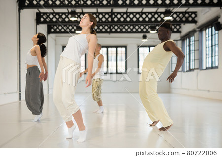 Men and women relax in dance hall 80722006