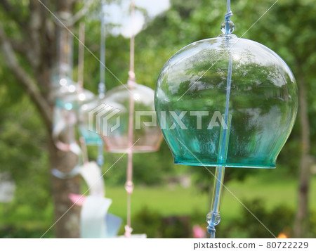 Wind chimes decorated in a park swaying in the wind Wind chimes decorated in a park swaying in the wind 80722229