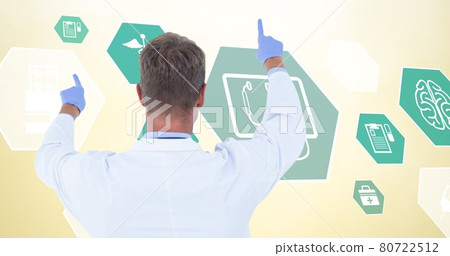 Composition of male doctor over digital icons on yellow background Composition of male doctor over digital icons on yellow background 80722512