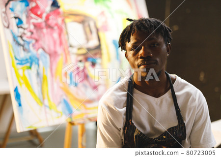 Portrait of african american male painter at work looking at camera in art studio 80723005