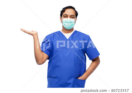indian male doctor in blue uniform and mask indian male doctor in blue uniform and mask 80723557