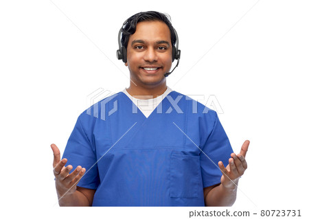 smiling indian doctor or male nurse with headset smiling indian doctor or male nurse with headset 80723731
