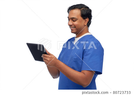 smiling doctor or male nurse using tablet computer smiling doctor or male nurse using tablet computer 80723733