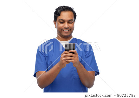 smiling doctor or male nurse using smartphone smiling doctor or male nurse using smartphone 80723782