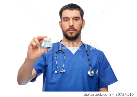 doctor or male nurse with medicine and stethoscope doctor or male nurse with medicine and stethoscope 80724110