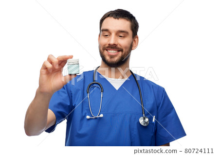 doctor or male nurse with medicine and stethoscope doctor or male nurse with medicine and stethoscope 80724111