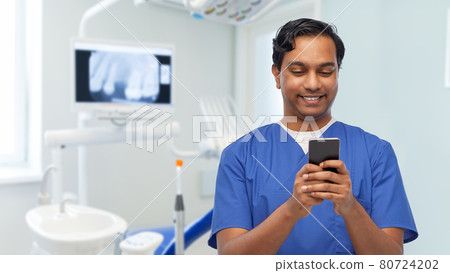 smiling doctor or male nurse using smartphone 80724202