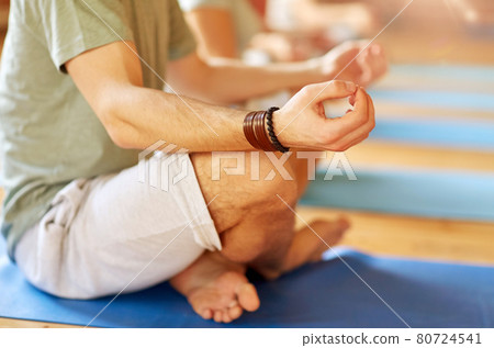 group of people making yoga exercises at studio group of people making yoga exercises at studio 80724541