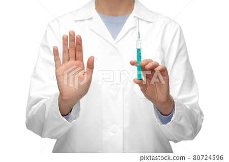 close up of doctor with syringe shows stop gesture close up of doctor with syringe shows stop gesture 80724596