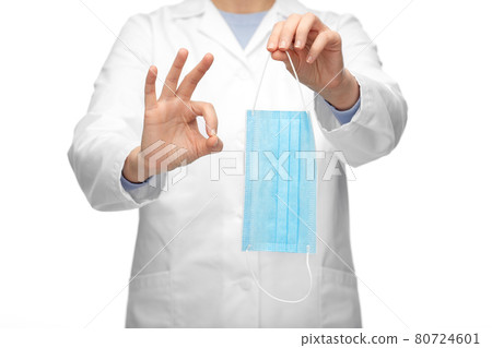 female doctor with medical mask showing ok gesture female doctor with medical mask showing ok gesture 80724601