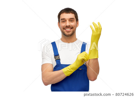 male worker or cleaner in overall wearing gloves male worker or cleaner in overall wearing gloves 80724626