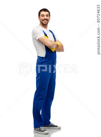 happy male worker or cleaner in overall and gloves 80724635