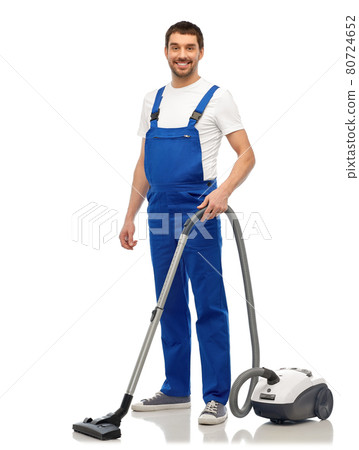 male worker cleaning floor with vacuum cleaner male worker cleaning floor with vacuum cleaner 80724652