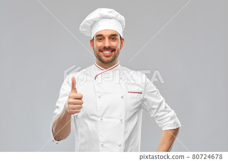 smiling male chef in toque showing thumbs up smiling male chef in toque showing thumbs up 80724678