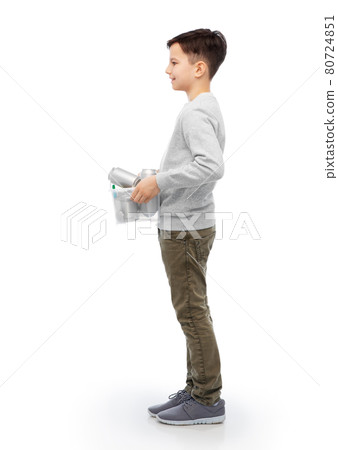 smiling boy sorting metallic waste 80724851