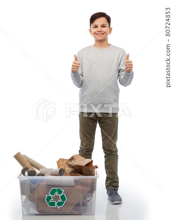 smiling boy sorting paper waste showing thumbs up 80724853