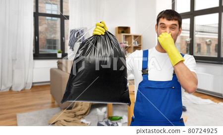 male worker or cleaner with garbage bag at home 80724925