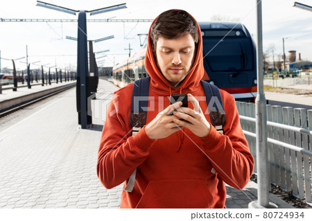 man with smartphone traveling by train man with smartphone traveling by train 80724934