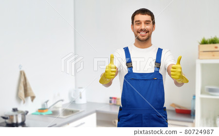 happy male worker or cleaner in gloves at kitchen 80724987