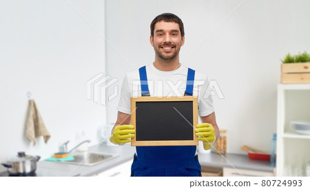 male cleaner with chalkboard at at kitchen 80724993