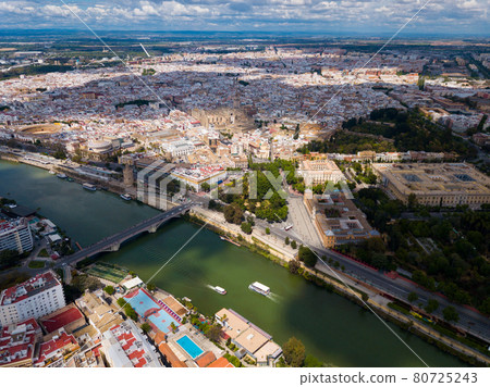 Aerial view Sevilla of city center with embankment of Guadalquivir. Aerial view Sevilla of city center with embankment of Guadalquivir. 80725243