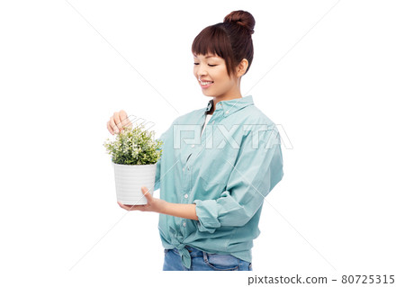 happy smiling asian woman holding flower in pot 80725315