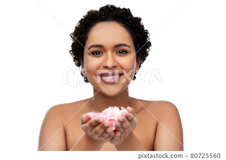 young african american woman with flower petals 80725560