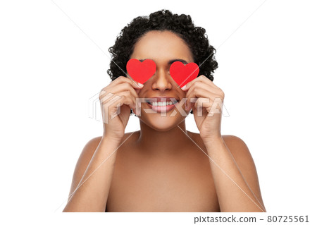 african american woman covering eyes with hearts african american woman covering eyes with hearts 80725561